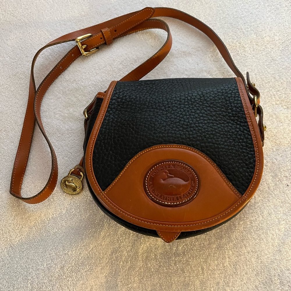 Dooney & Bourke All Weather Leather Black & Tan Saddle Crossbody Bag.